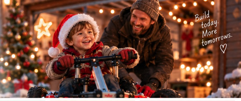 Father and child riding an Infento at dusk with Christmas lights